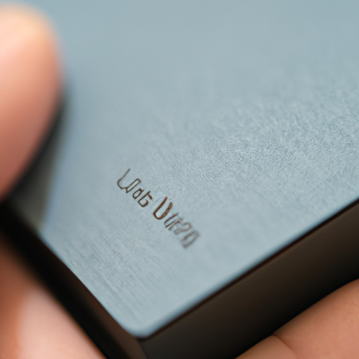 A close-up of a hand comfortably holding the edge of the kobo libra 2