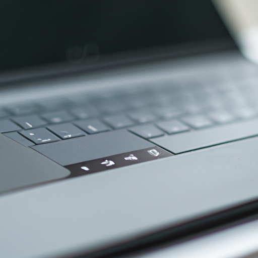 A close-up of the laptops keyboard and touchpad with the screen displaying a multitasking scenario